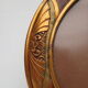 Cadre art nouveau ovale  en bois, décor flamé et  or