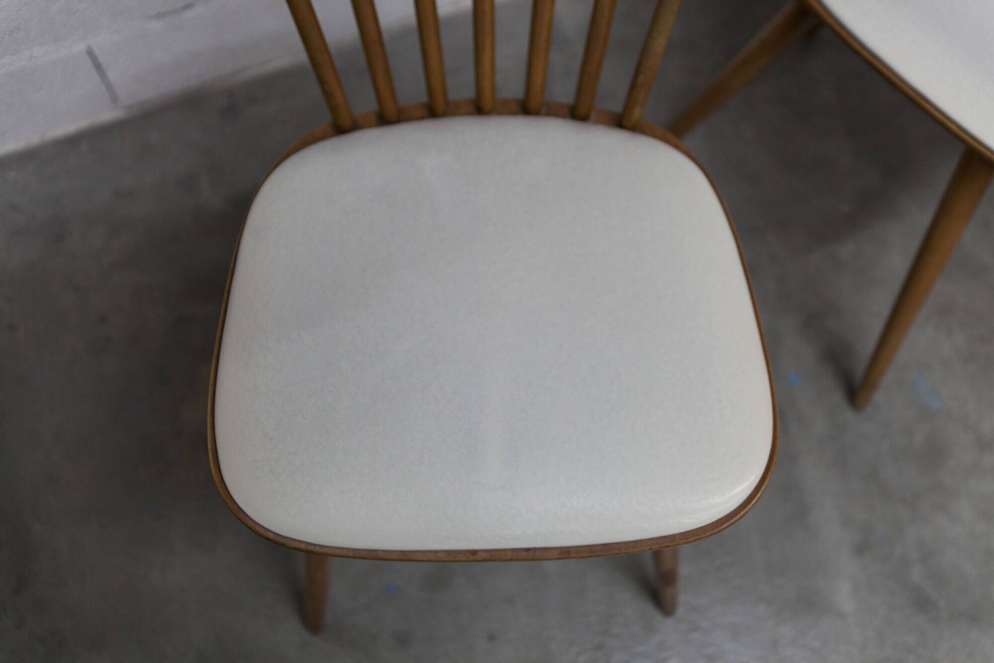 Pair of Baumann Menuet chairs, Honey patina, White skai seat