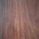 Round wooden table with thin legs