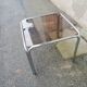 Table basse vintage chrome et verre fumé marron