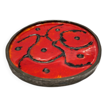 Circular red and black brutalist ceramic dish from the 1970s