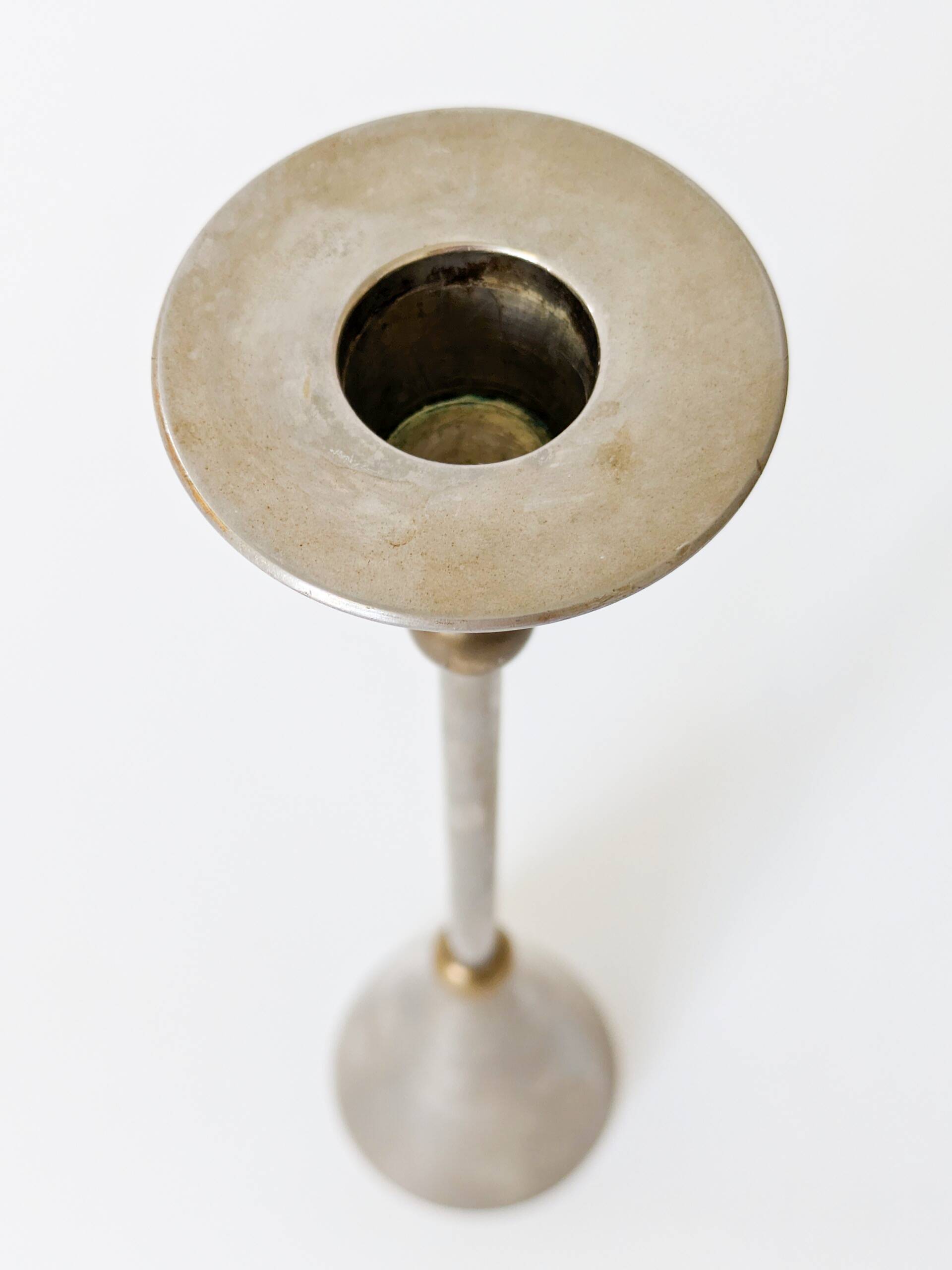 Pair of postmodern candlesticks in Memphis style made of steel and brass.