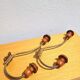 Pair of antique wooden and metal coat hooks