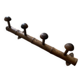 Old wooden wall coat rack