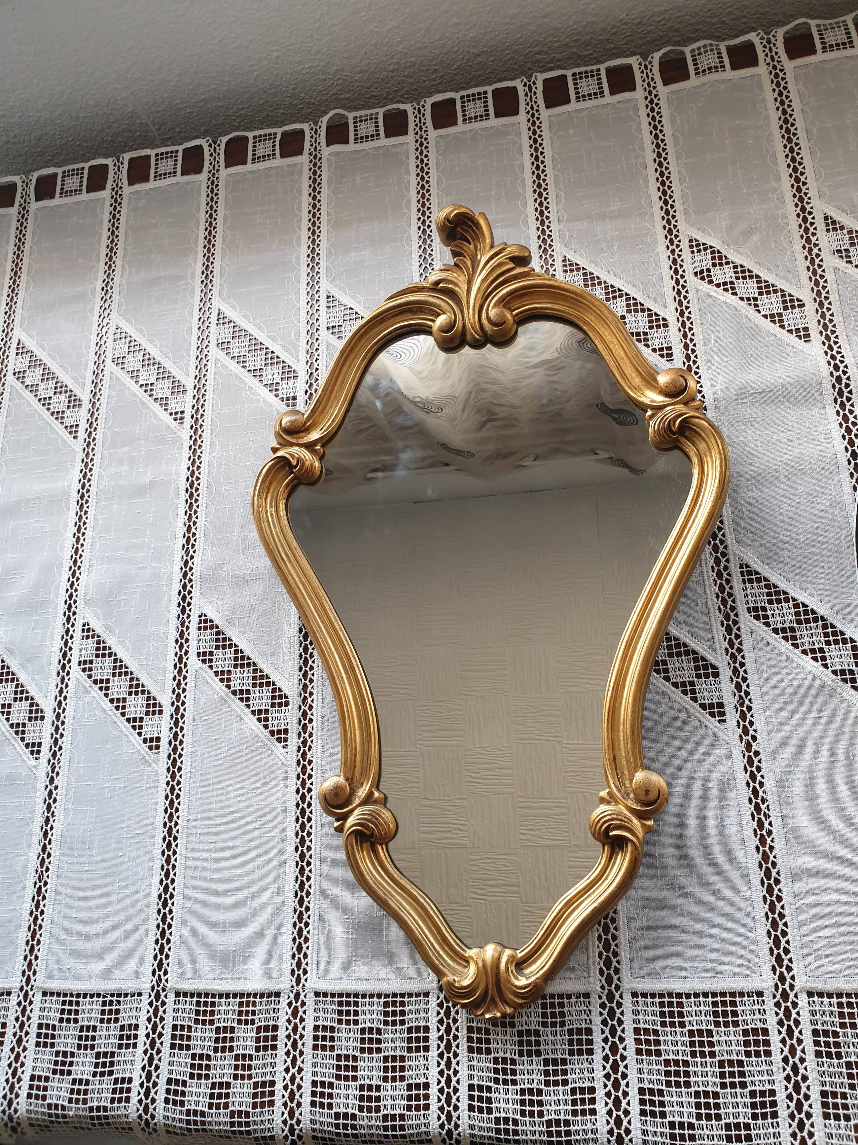 Rocaille mirror in gilded carved wood