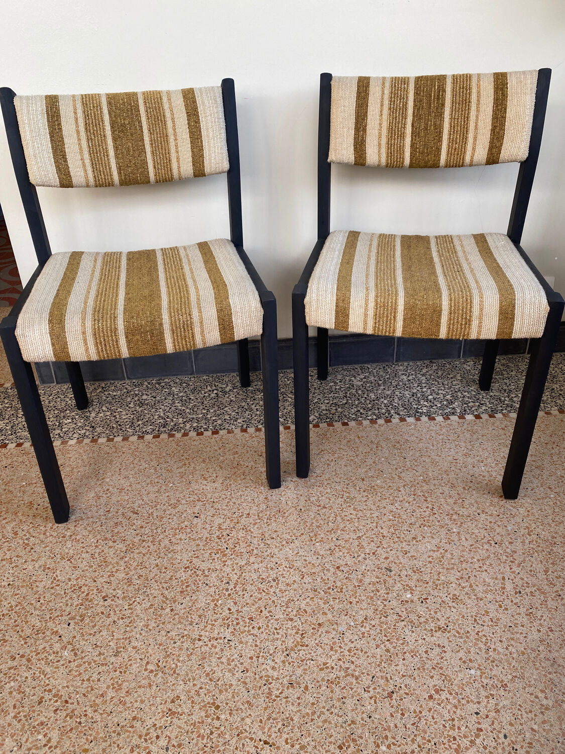 2 wooden chairs and vintage fabric