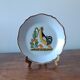 Decorative plate in the 18th-century style. Decoration of a stylised rooster.