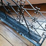 Vintage black wrought iron magazine rack