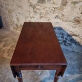 Antique English drop-leaf table in mahogany, late 19th century.