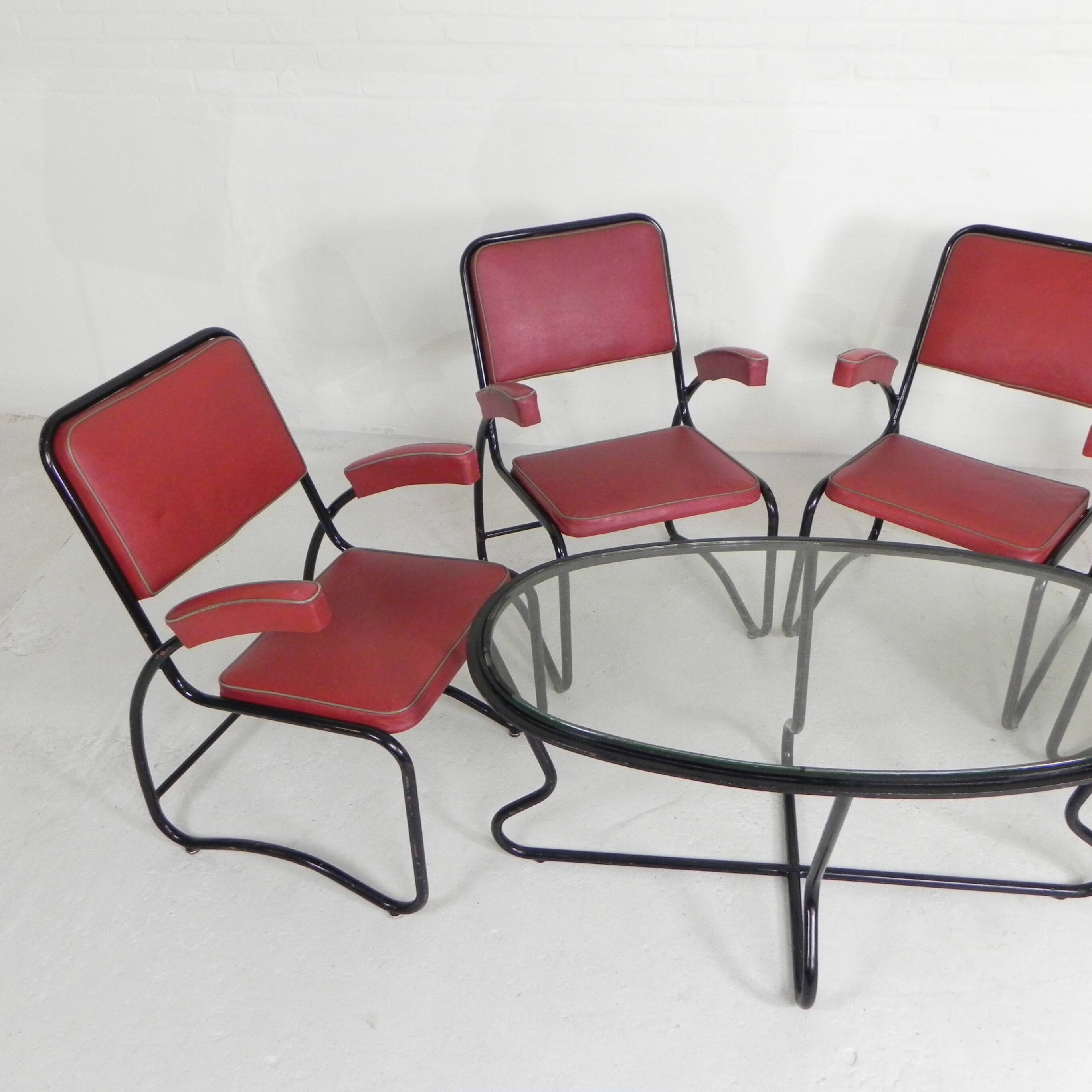 Set of 4 armchairs and a coffee table with tubular structure in Bauhaus style, 1950s.