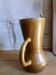 Vintage pitcher with enamelled earth cove