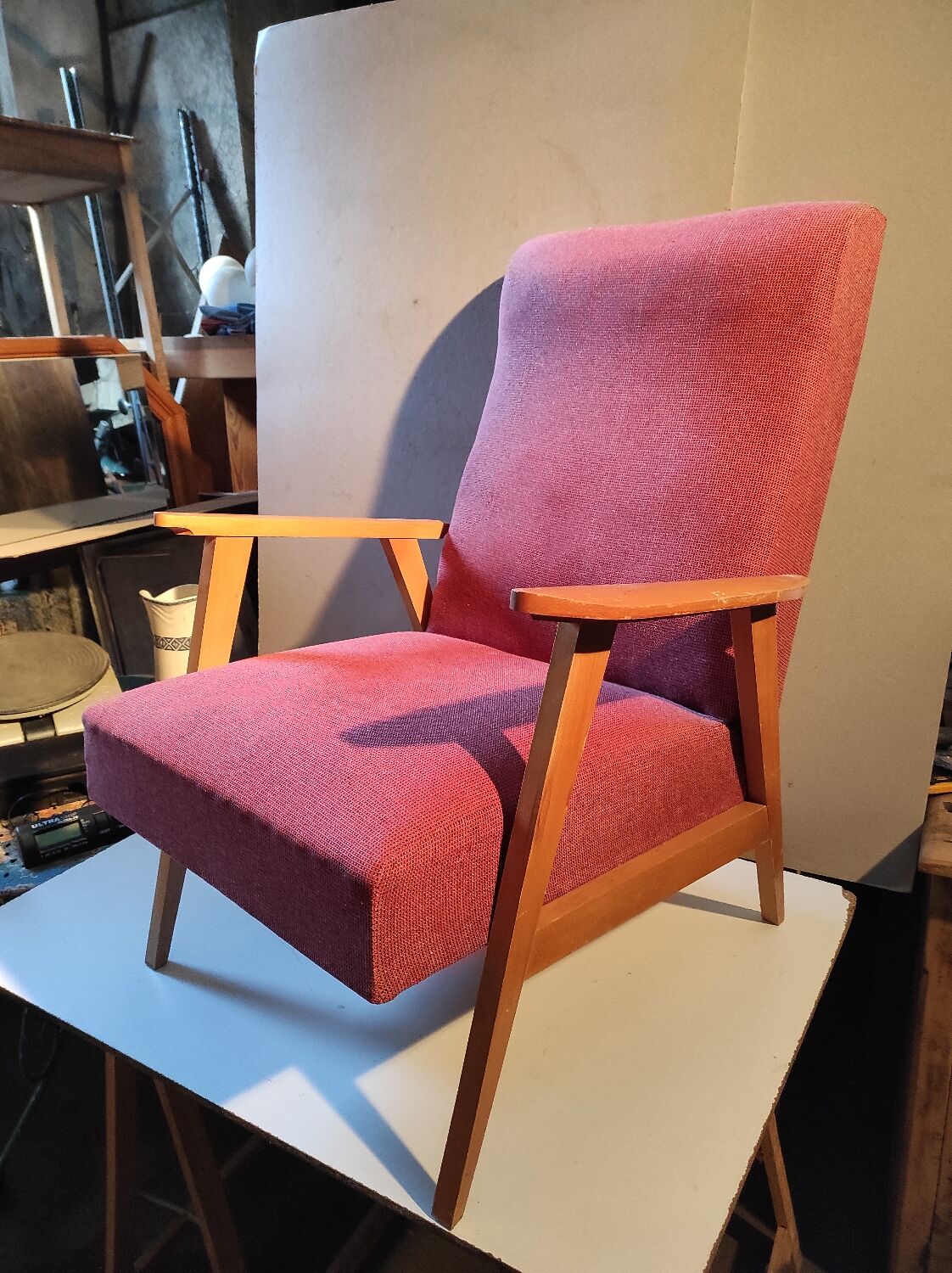 Vintage red armchair with compass feet in Scandinavian design