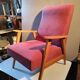 Vintage red armchair with compass feet in Scandinavian design