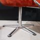 Orange velvet swivel armchair