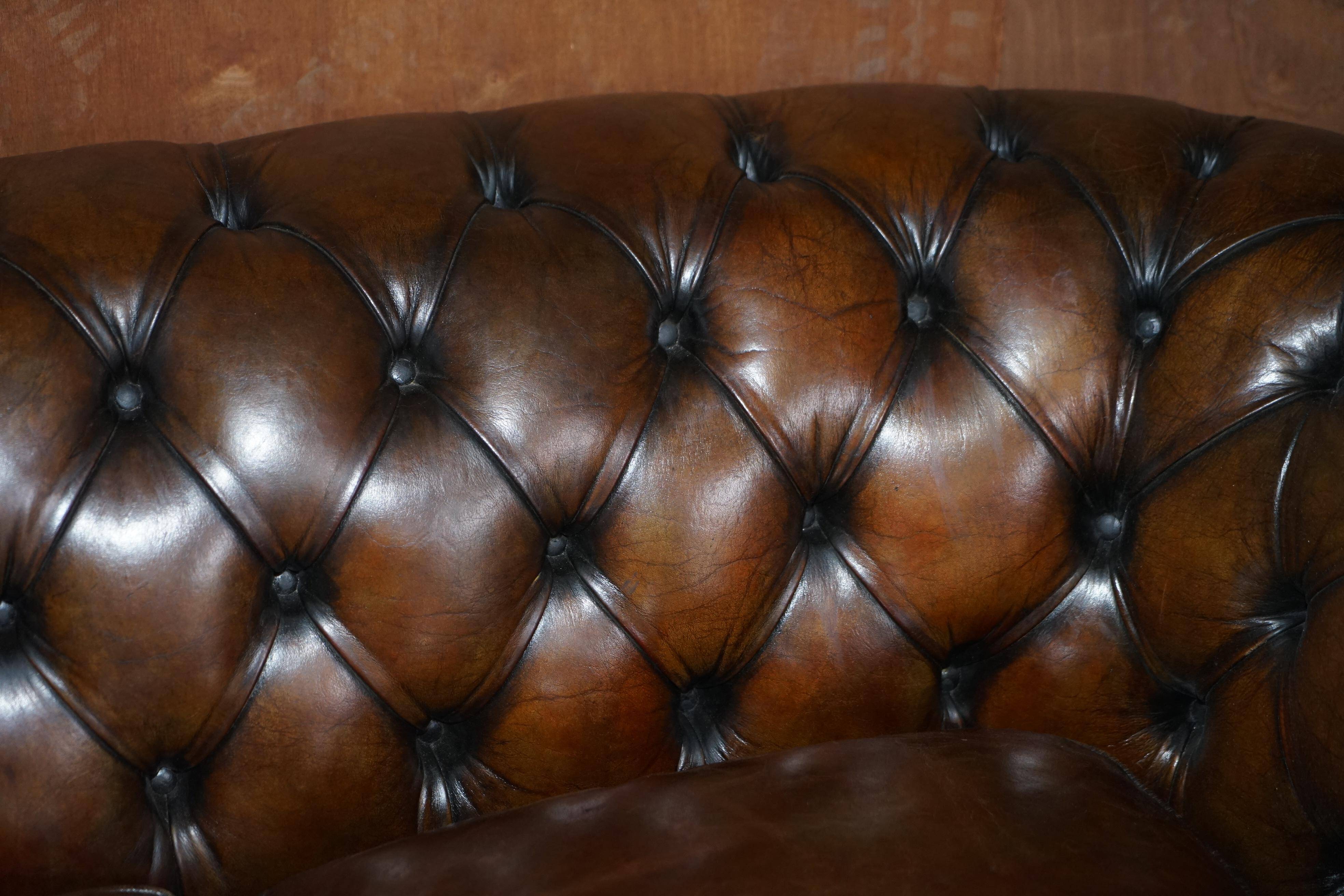Restored leather Chesterfield sofa, walnut legs.