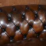 Restored leather Chesterfield sofa, walnut legs.