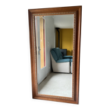 Large bevelled tabletop mirror in carved gilded wood.