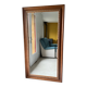 Large bevelled tabletop mirror in carved gilded wood.