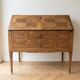 Antique wooden secretary desk with marquetry.