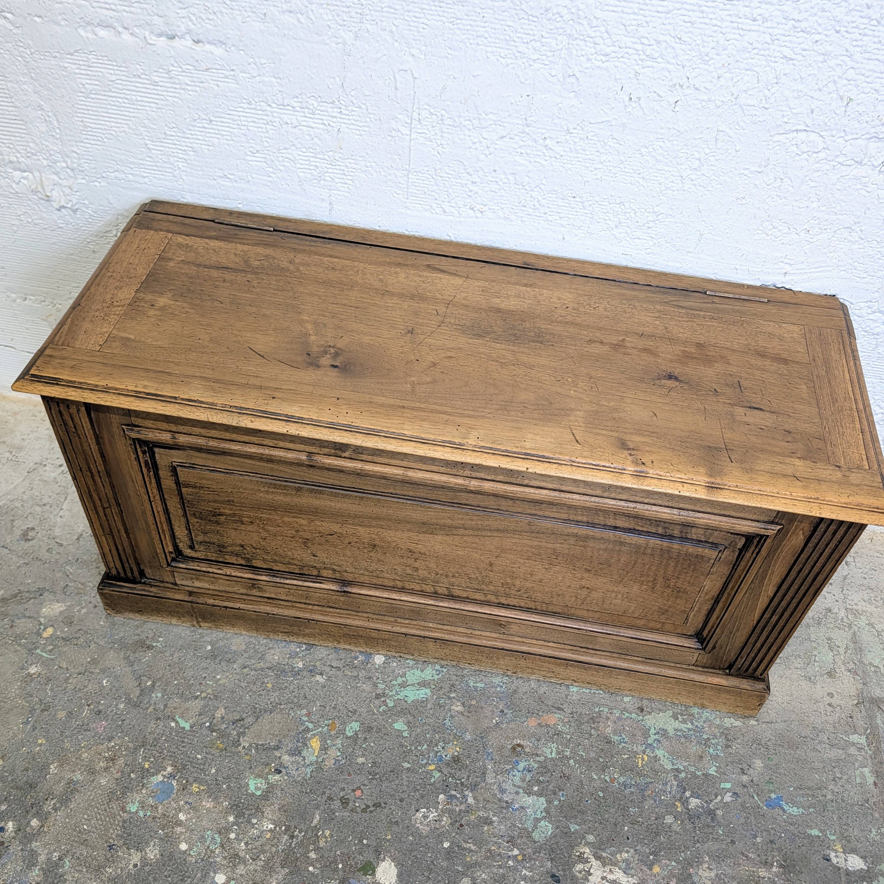 Antique wooden chest with moulded panels