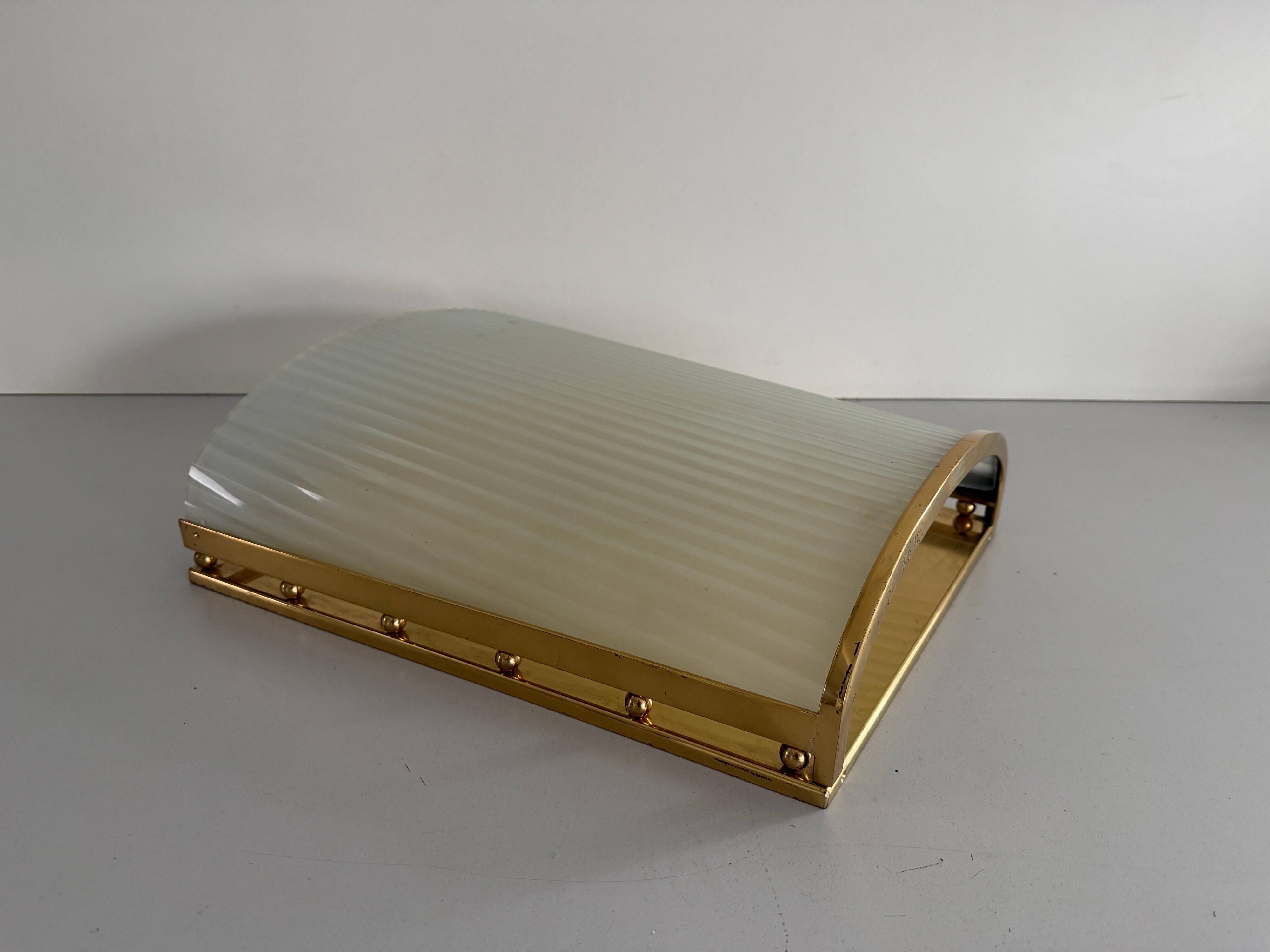 Large heavy glass wall light with a brass frame from the mid-century, 1950s, Italy.