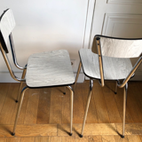 White and grey Formica chairs