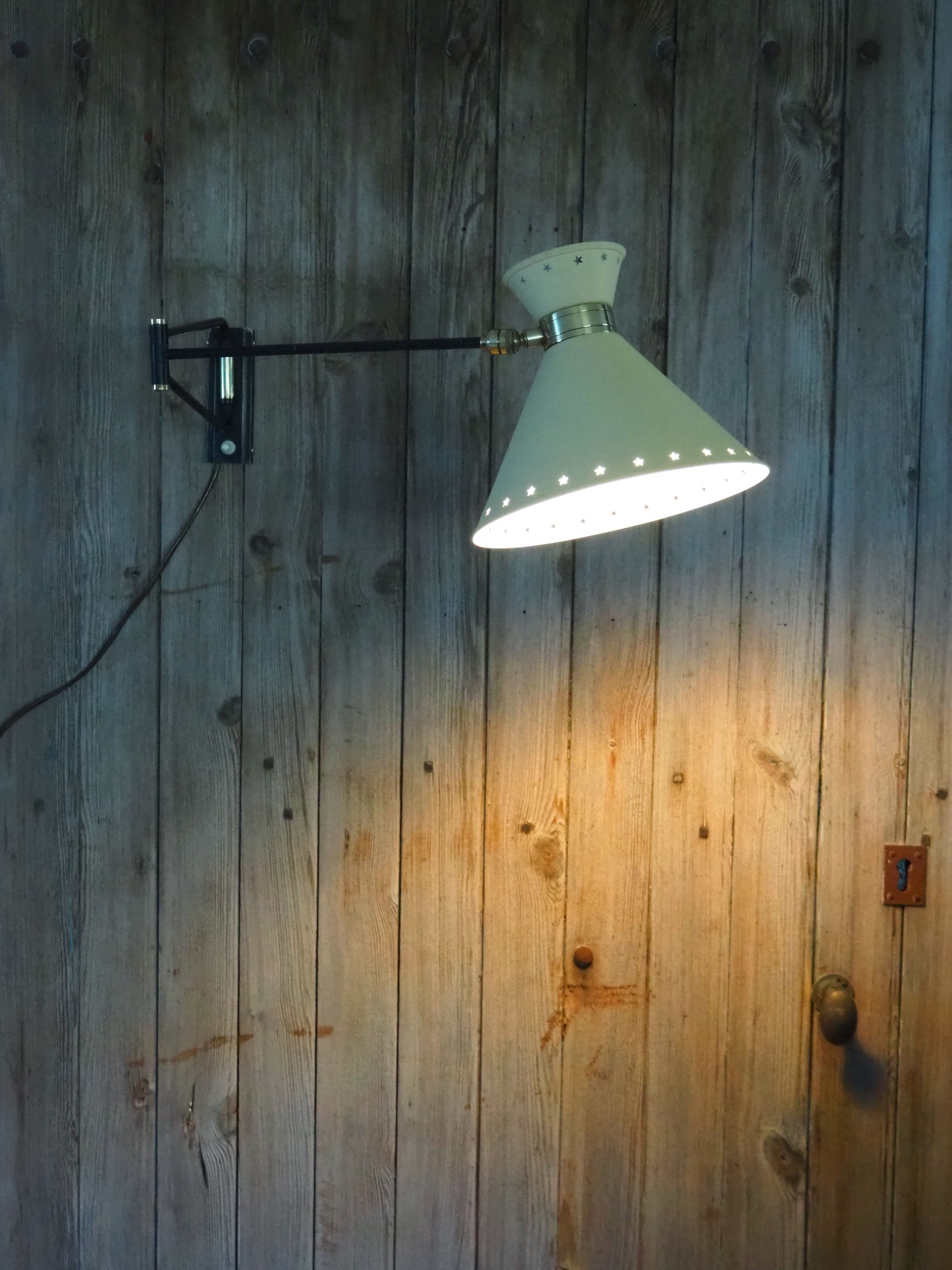 Diabolo articulated wall lamp by designer René Mathieu