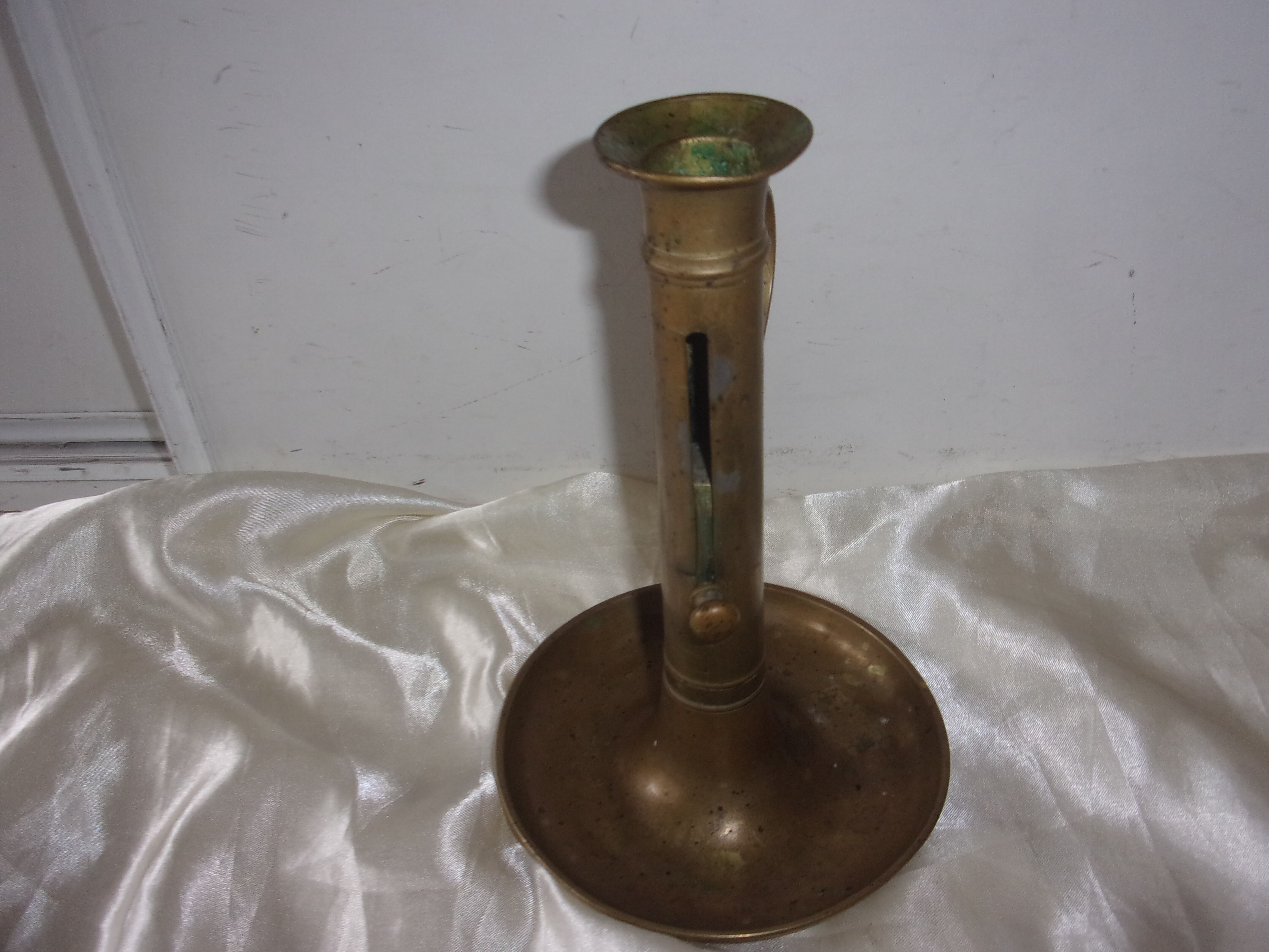 Brass pusher candle holder