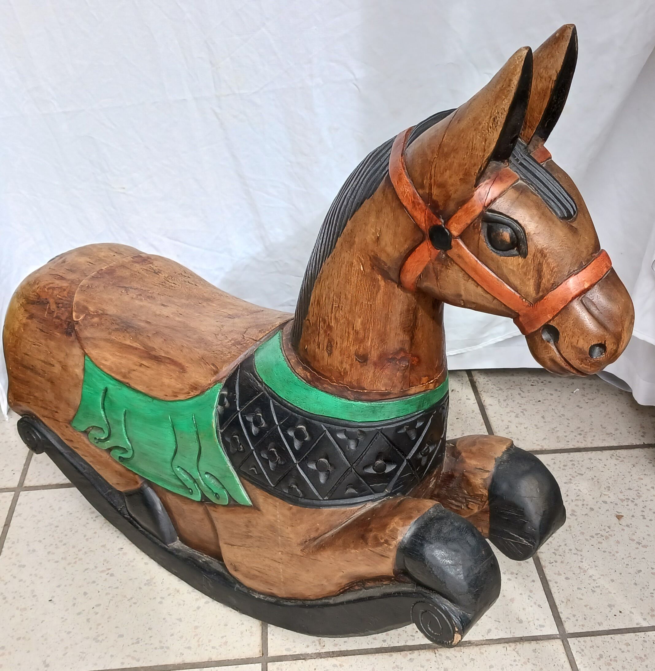 Carved wooden rocking horse, hand painted