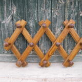 Old accordion coat rack