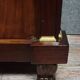Rare four-column secretary from the Empire period in flame mahogany and bronze.