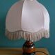 Turned wood bedside lamp with fabric lampshade