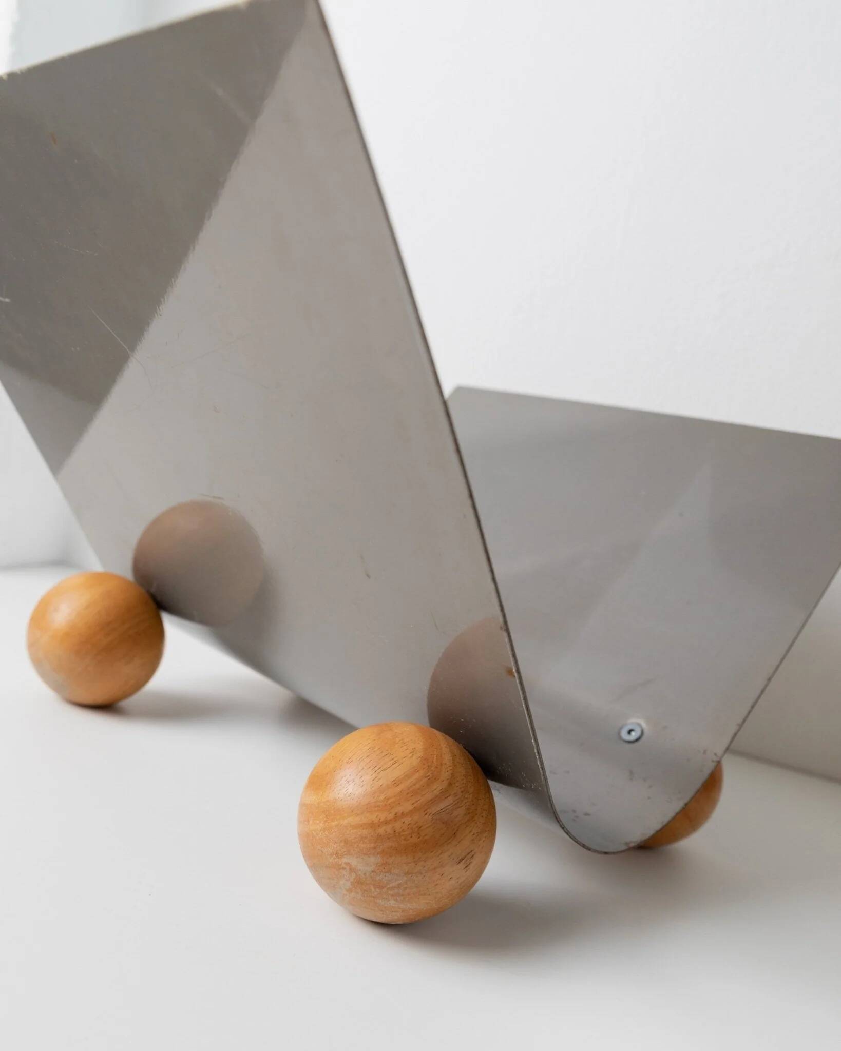 Silver metal magazine rack with wooden ball feet - Space Age 1980s retro storage