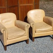 Pair of 1930s club armchairs in ivory leather.