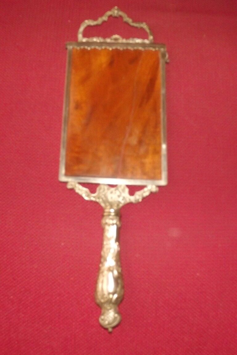 Mirror opposite hand 1900 silver metal