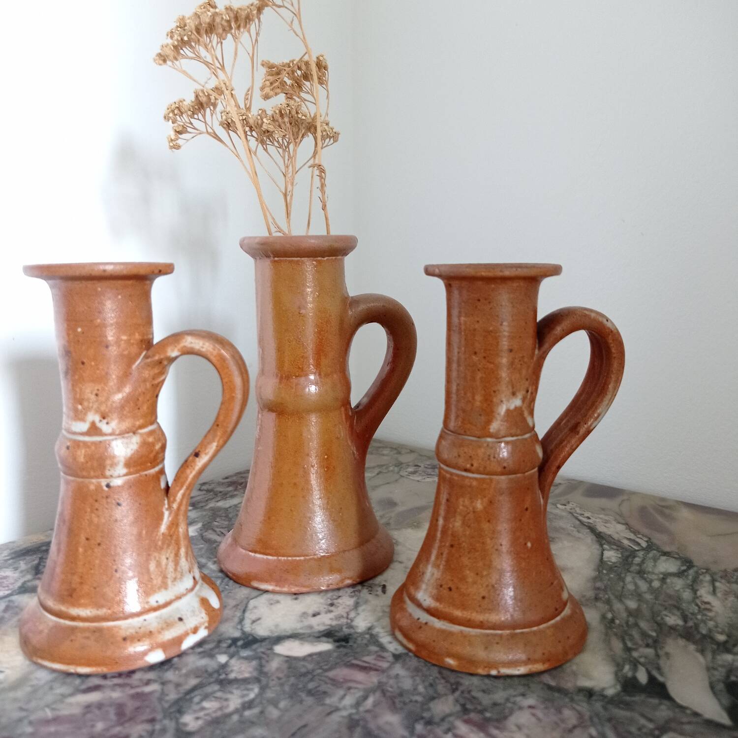 Enamelled stoneware candle holders