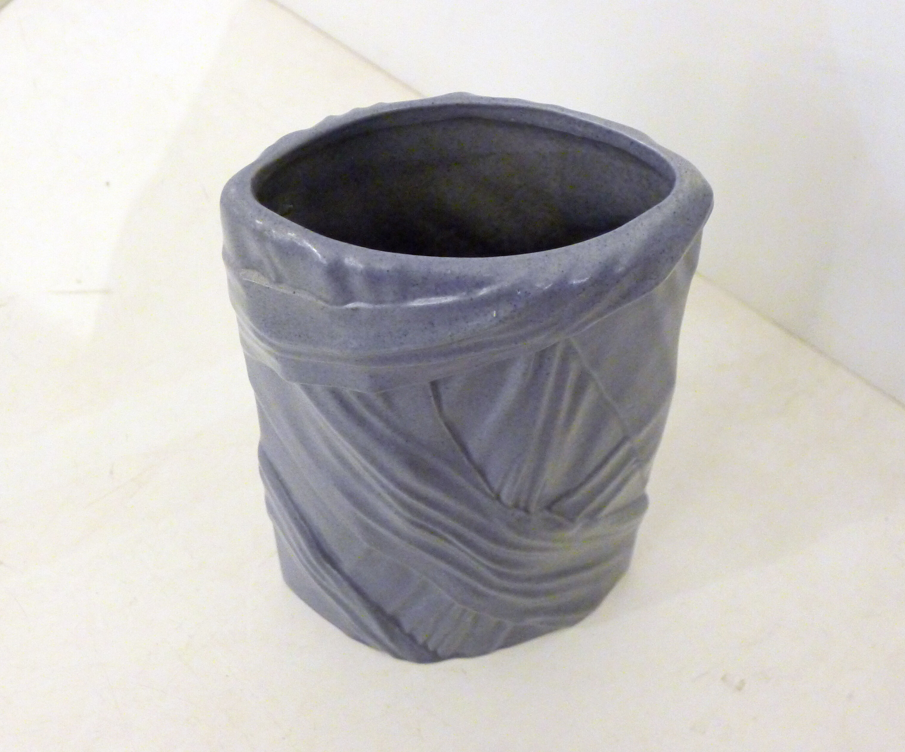 Purple vase, draped ribbons in relief