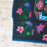 Handwoven floral wool rug, black background with pink roses and geometric design 207x144cm