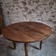 French antique round dining table in walnut, circa 1880–1900.