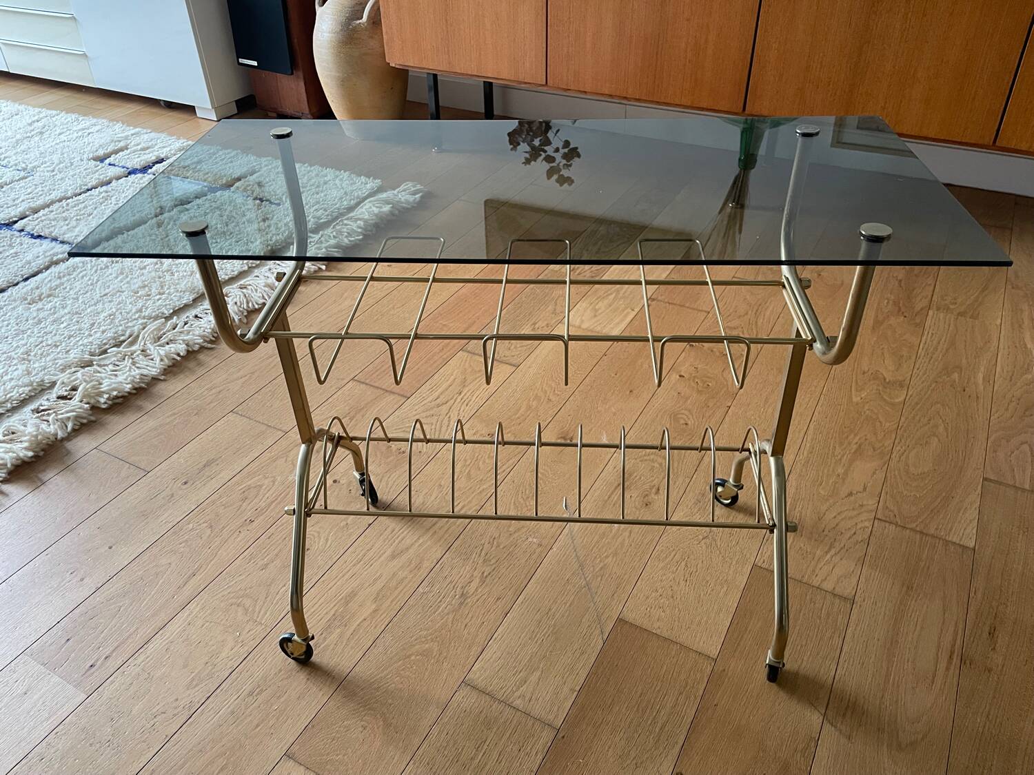 Green and brass trolley on wheels