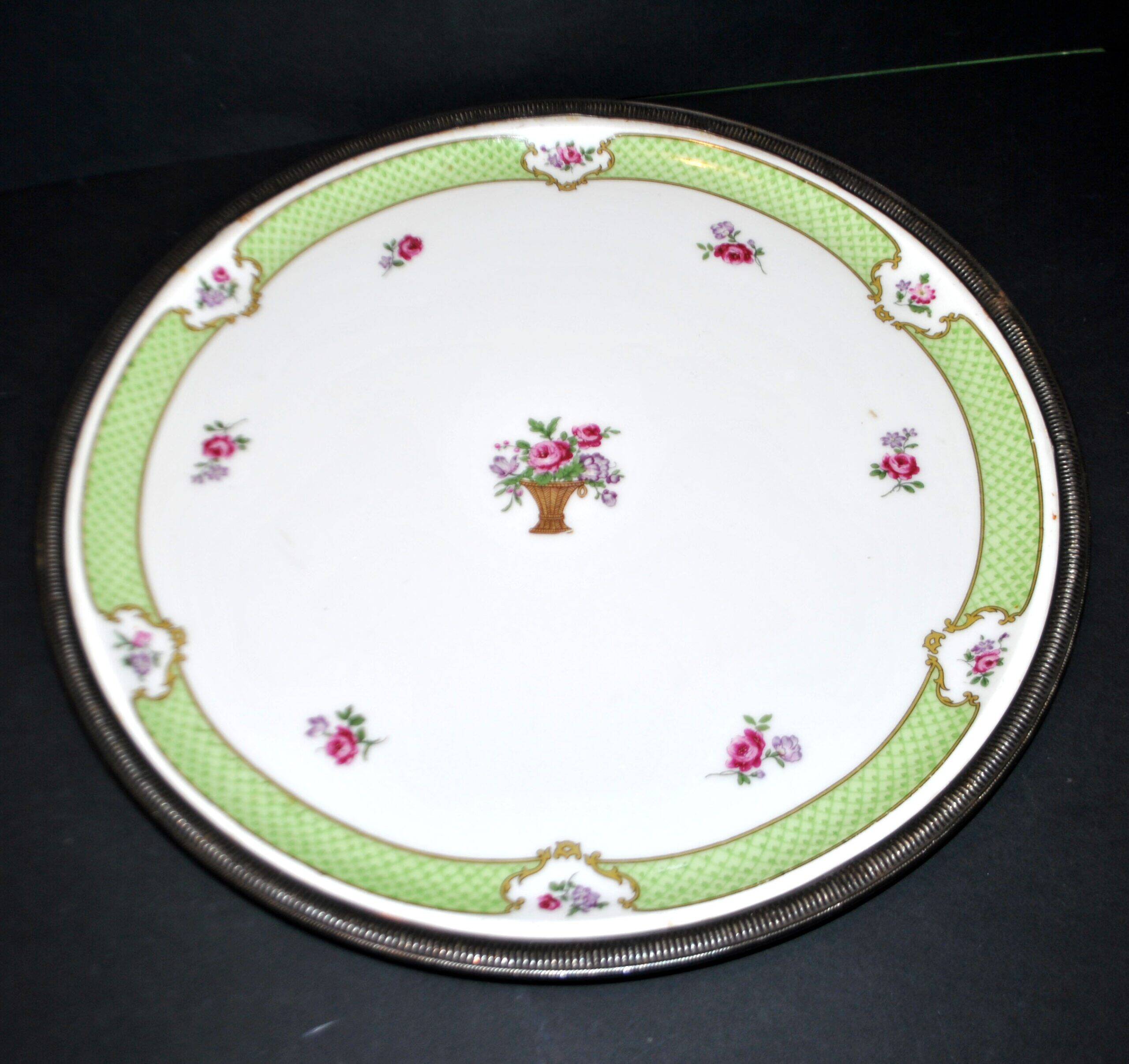 Haviland pie dish in Limoges porcelain with a Minerva silver rim.