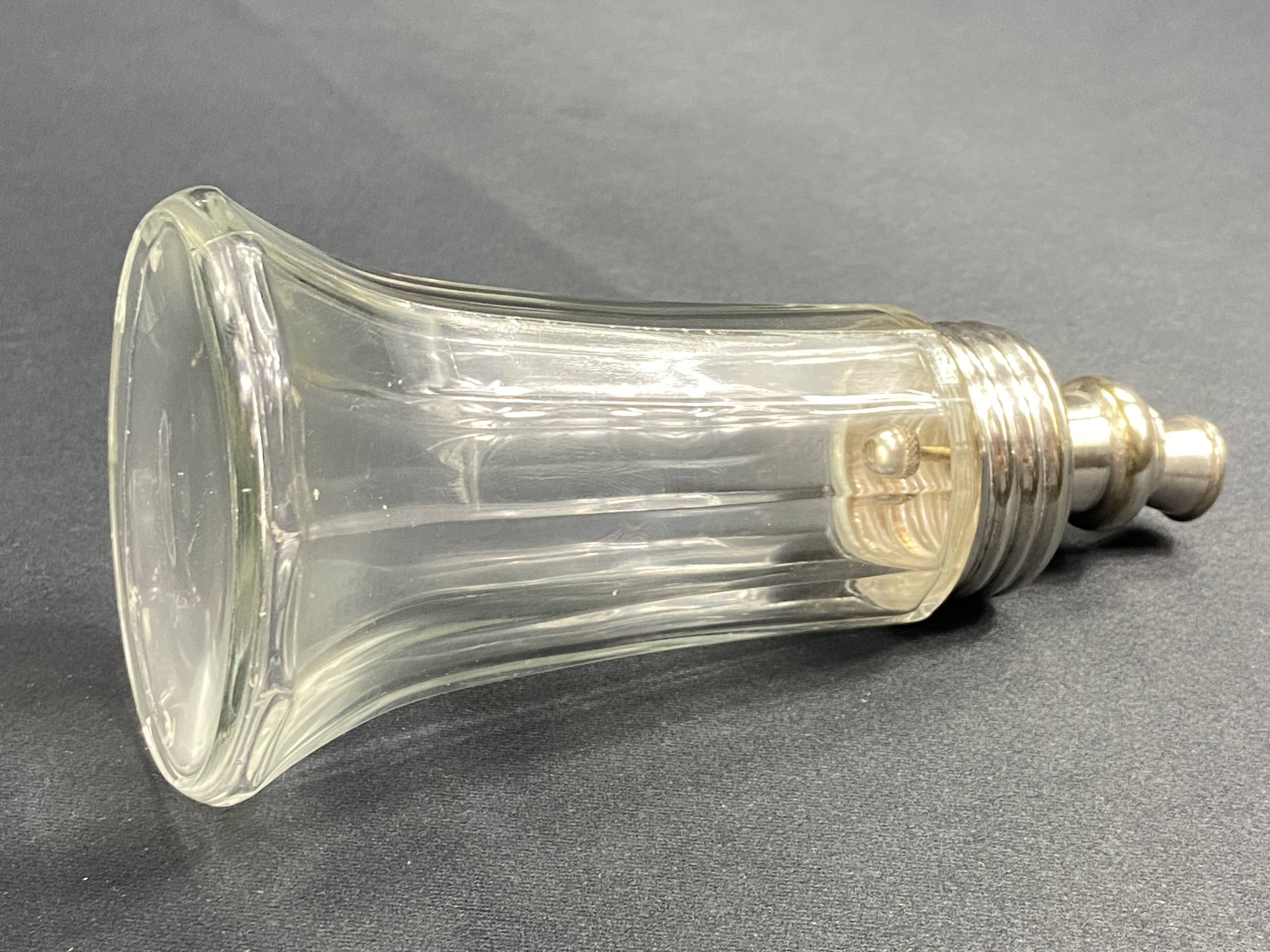 Glass and silver metal sugar shaker