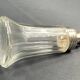 Glass and silver metal sugar shaker