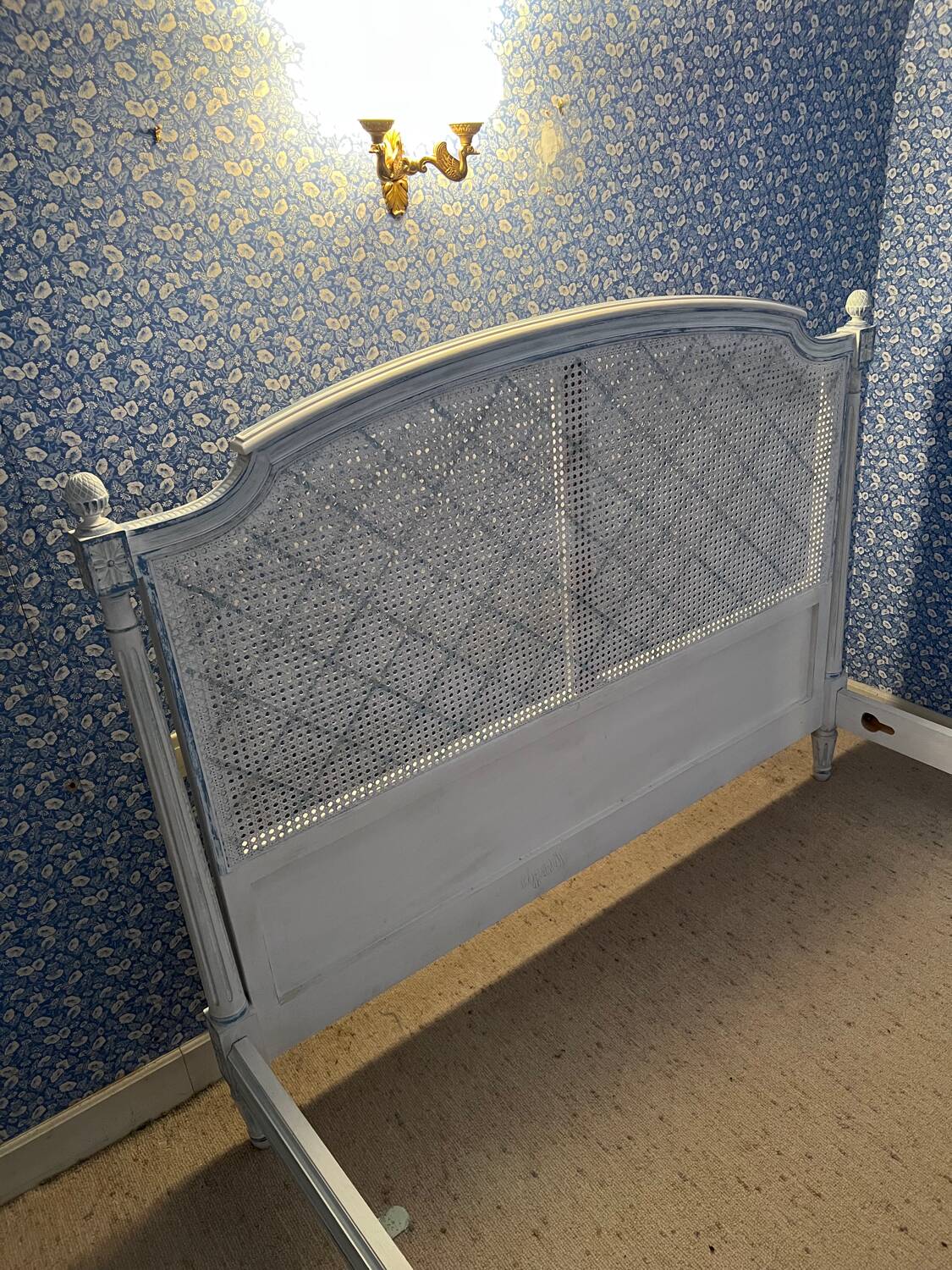 White wooden cane bed