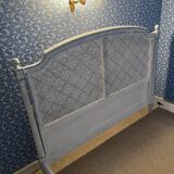 White wooden cane bed