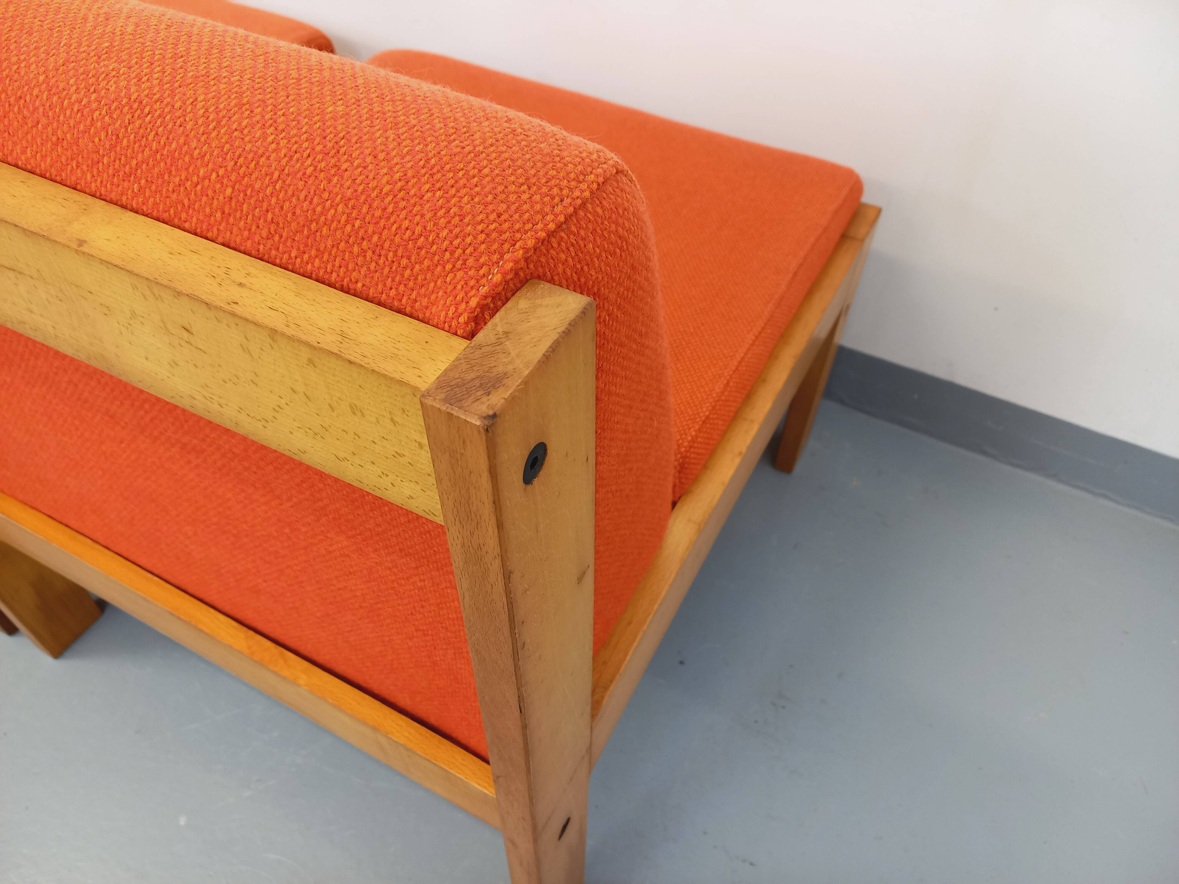 Set of 2 vintage Baumann armchairs in orange fabric and wood from the 80s
