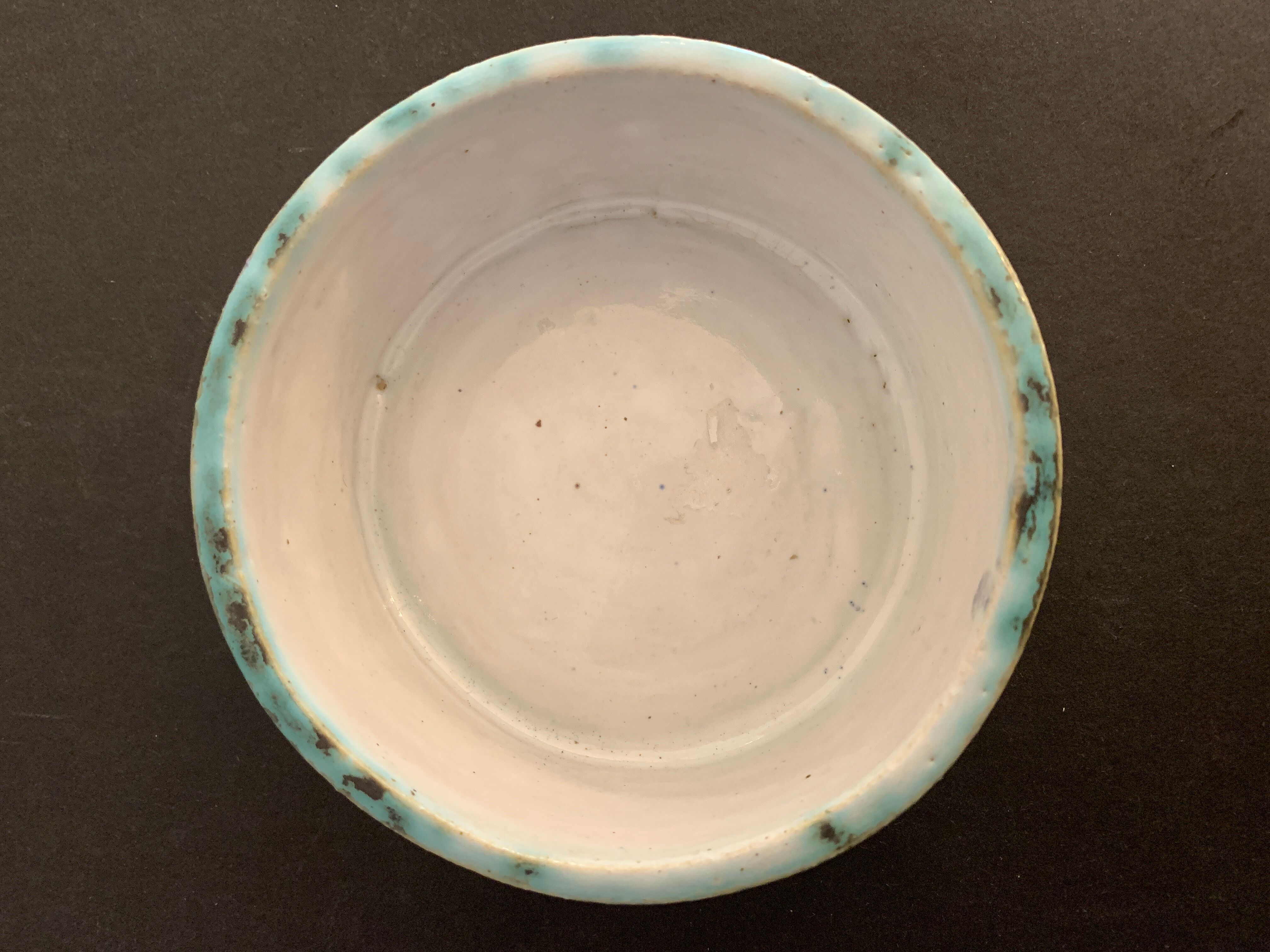 Round ashtray signed in sandstone with glazed interior