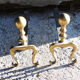 Old brass chenets foot in cabriole
