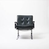 Lounge chair in green leather and chrome, 1970s