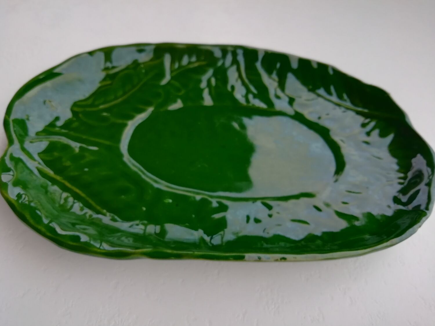 Oval flat decoration in relief